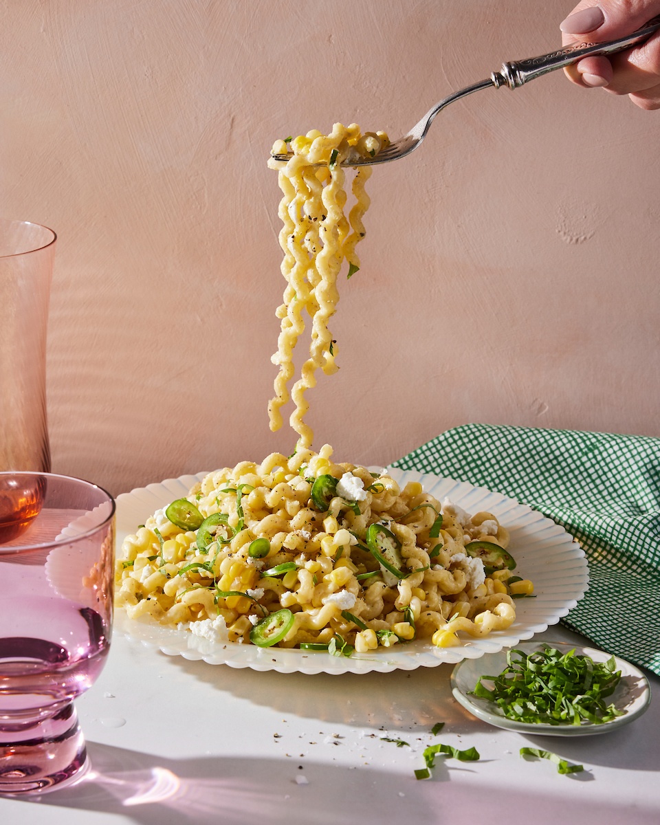 corn jalapeño pasta being lifted up with a fork