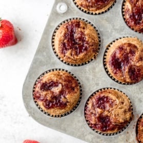 gluten free almond butter muffins in a muffin tin