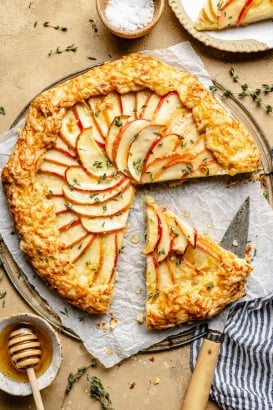 apple cheddar galette sliced on a wire rack