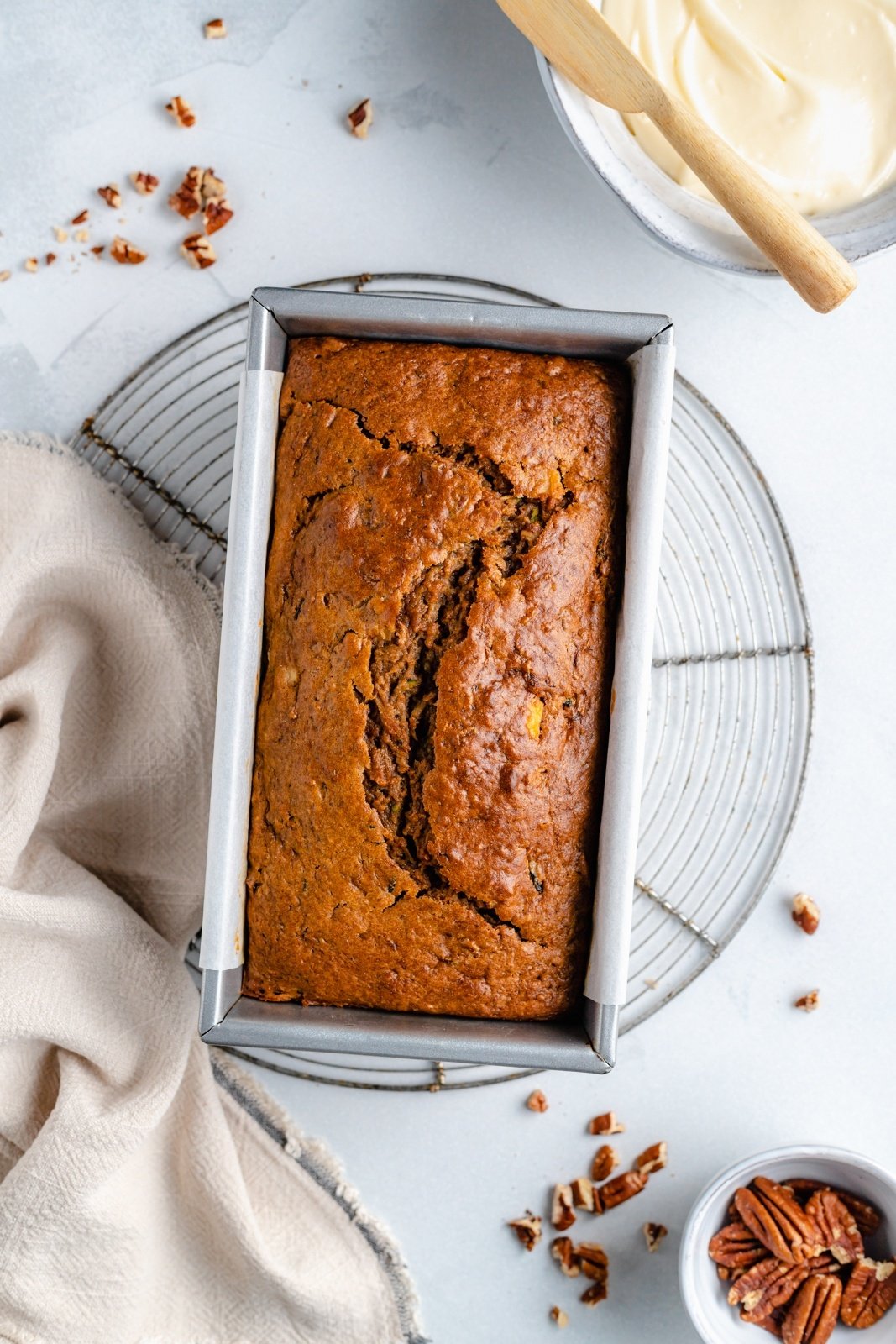 apple zucchini bread with applesauce in a loaf pan