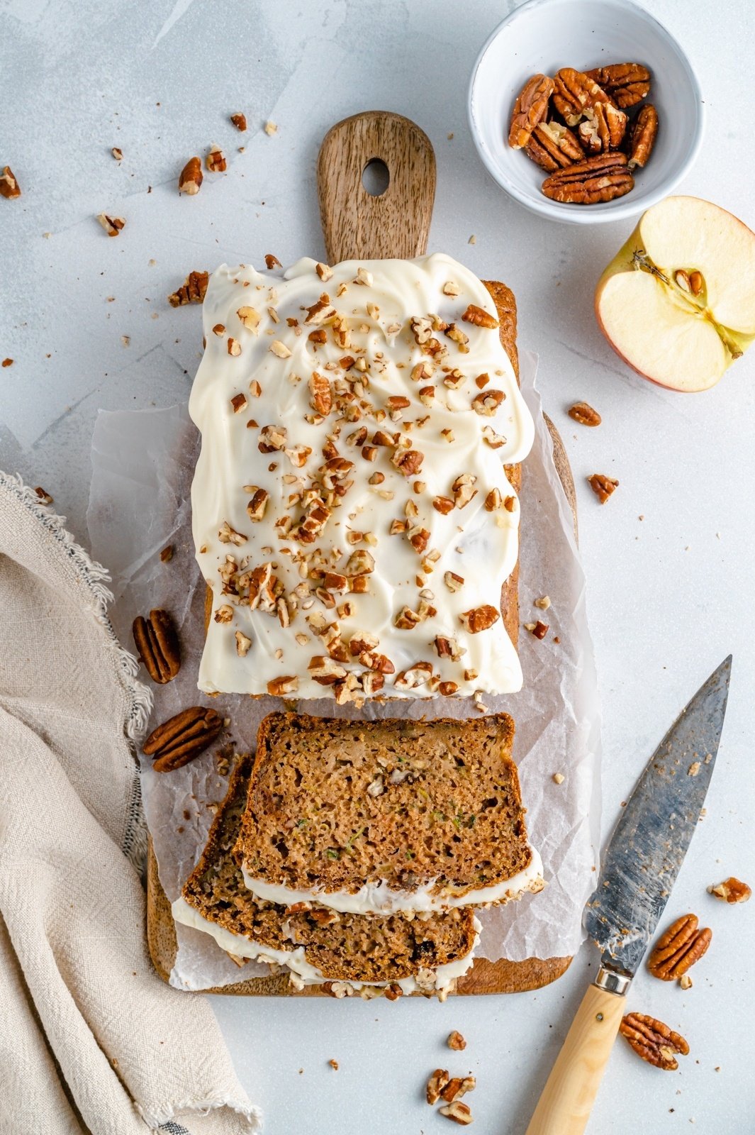 healthy apple zucchini bread sliced on a cutting board