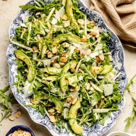 arugula pear salad on a platter