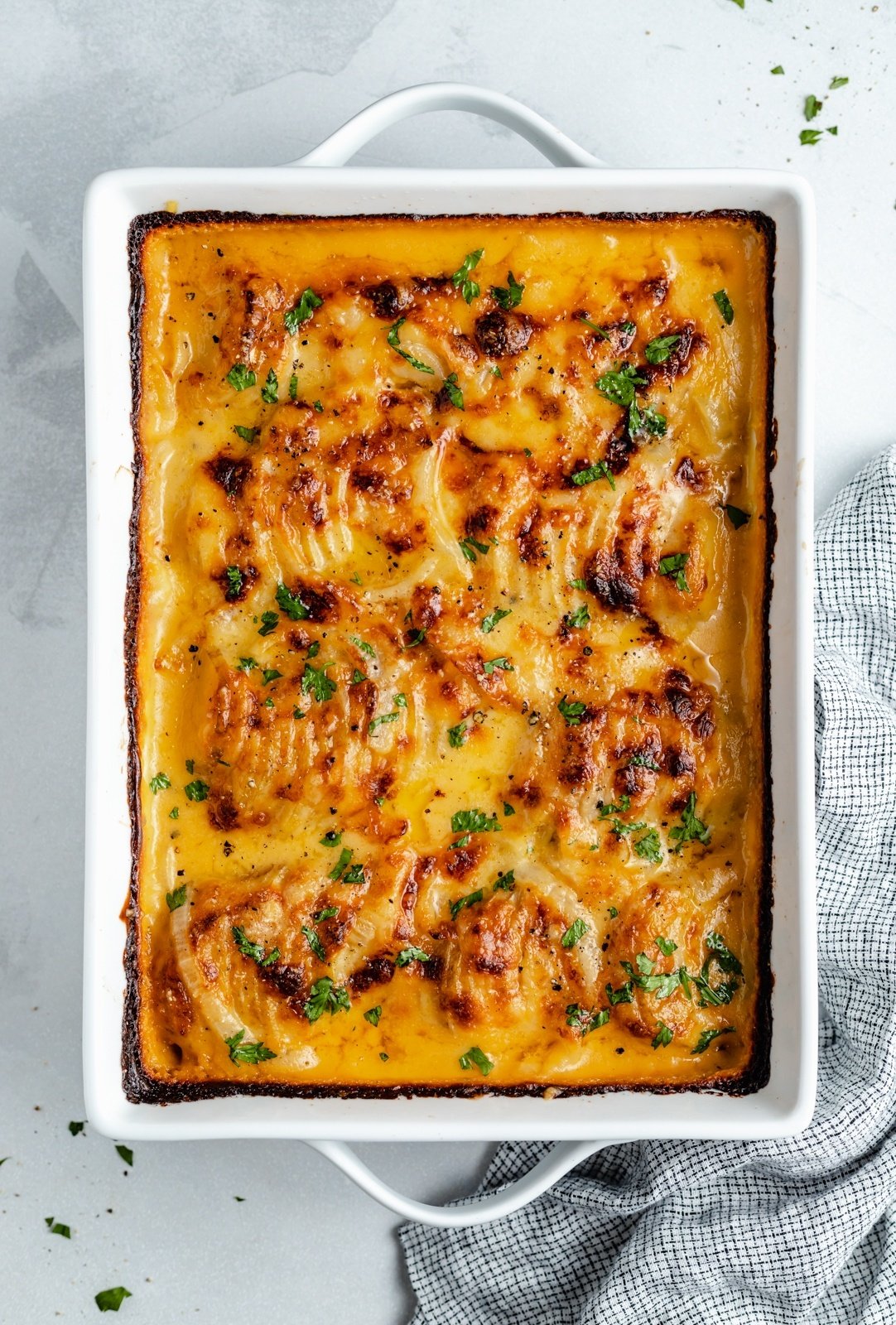 creamy au gratin potatoes in a baking dish