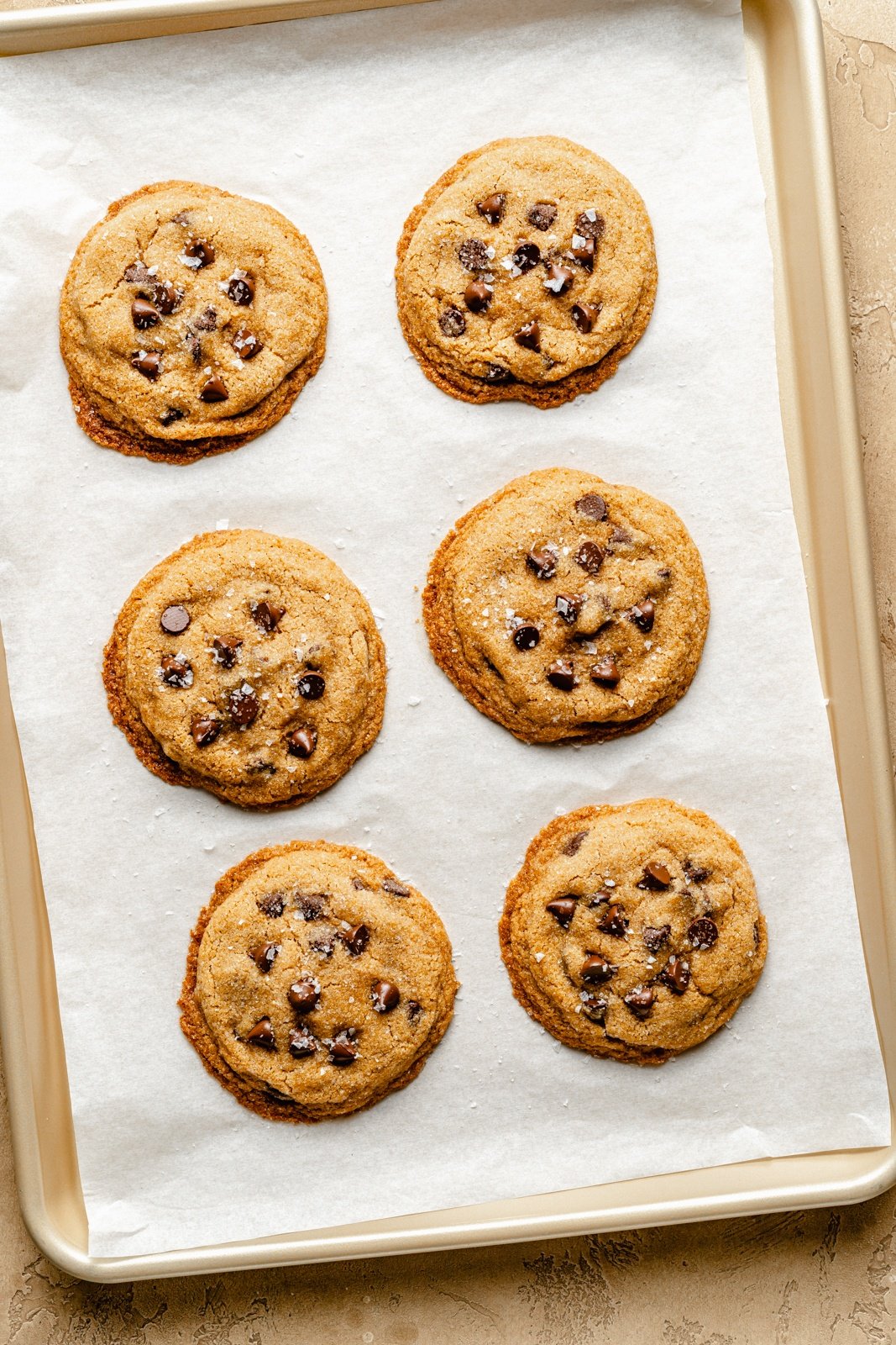 classic peanut butter cookies with chocolate chips on a baking sheet