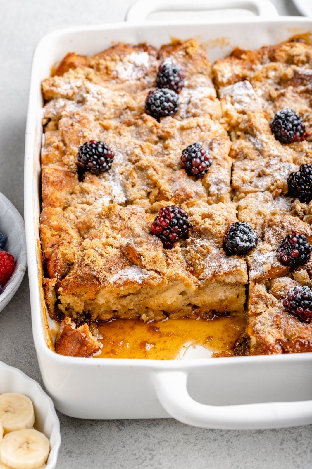 easy bananas foster french toast bake with a slice cut out