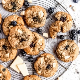 white chocolate blueberry coconut oatmeal cookies on a wire rack