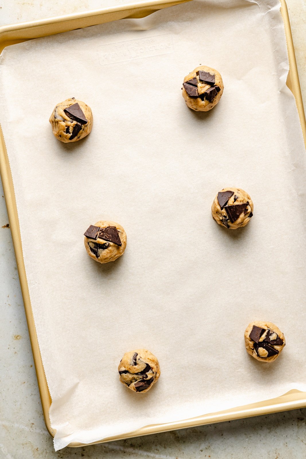 unbaked banana chocolate chip cookies on a baking sheet