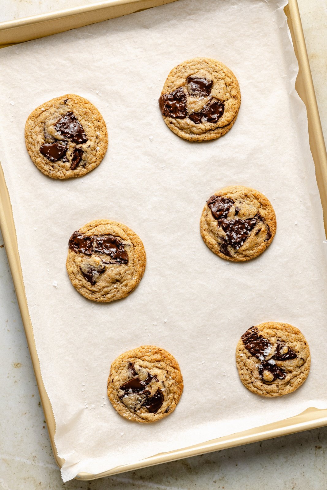 chocolate chunk banana cookies on a baking sheet