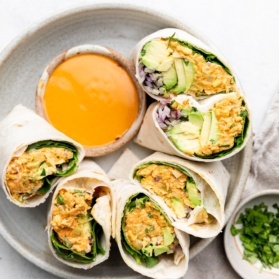 buffalo chickpea salad wraps sliced on a plate