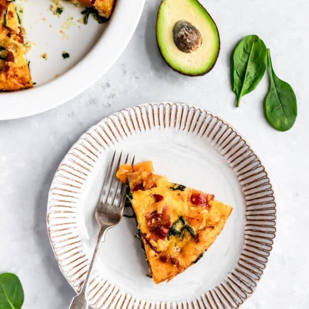 slice of butternut squash bacon spinach quiche on a plate