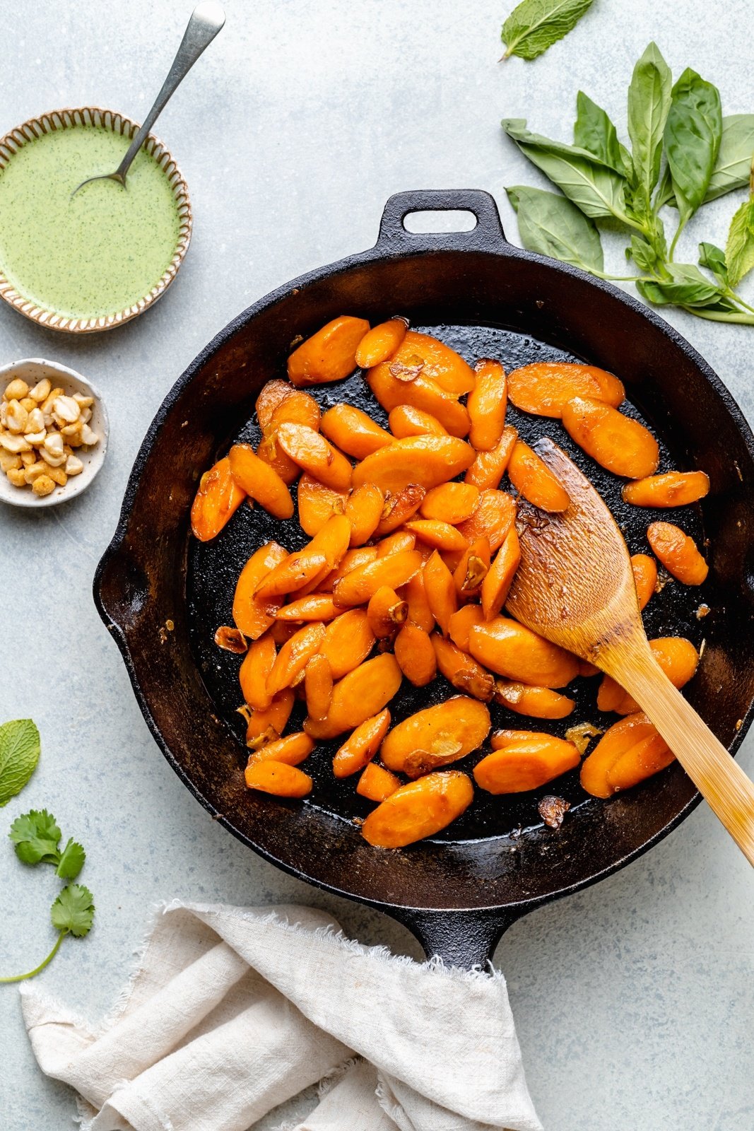 cooking caramelized carrots in a skillet