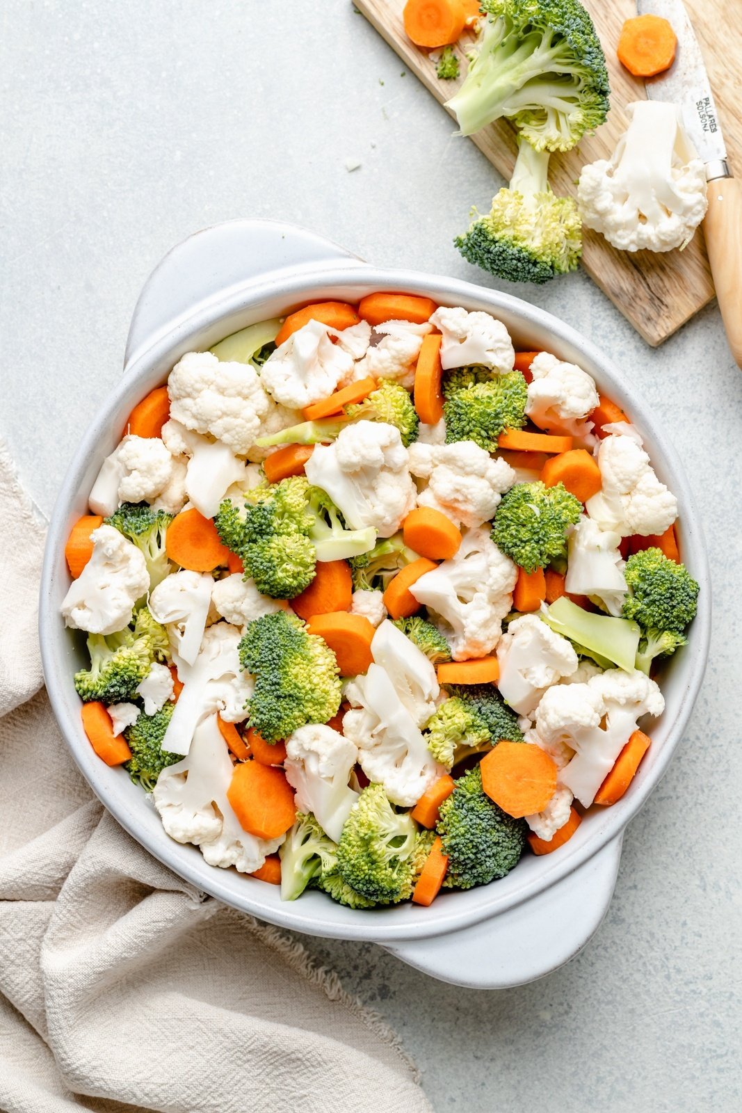 broccoli, cauliflower and carrots in a baking dish