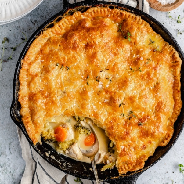 homemade cheddar broccoli leftover turkey pot pie in a skillet with a spoon