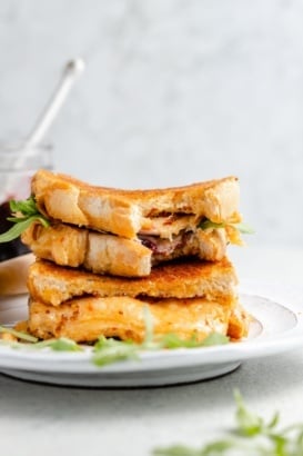 turkey grilled cheese sandwiches with cherry jam in a stack