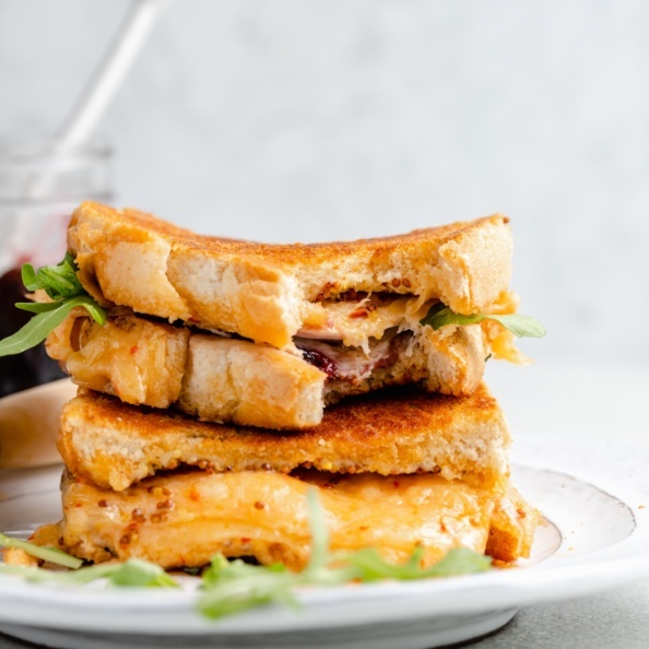 turkey grilled cheese sandwiches with cherry jam in a stack