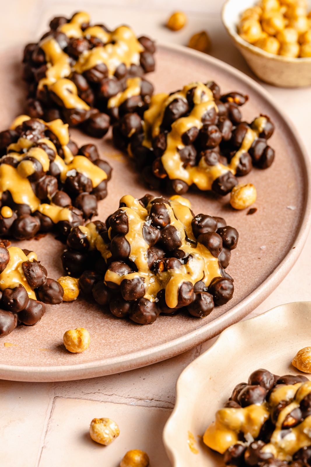 chocolate covered chickpea clusters on a plate