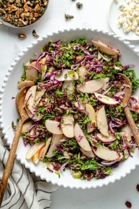 kale apple salad in a serving bowl