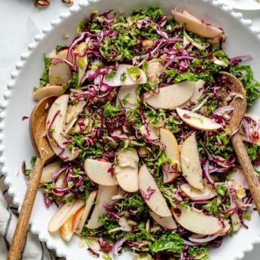 kale apple salad in a serving bowl