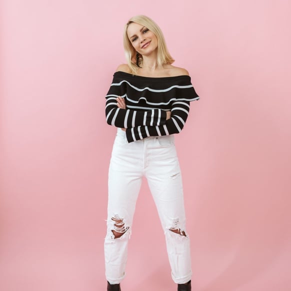 monique standing with a pink background