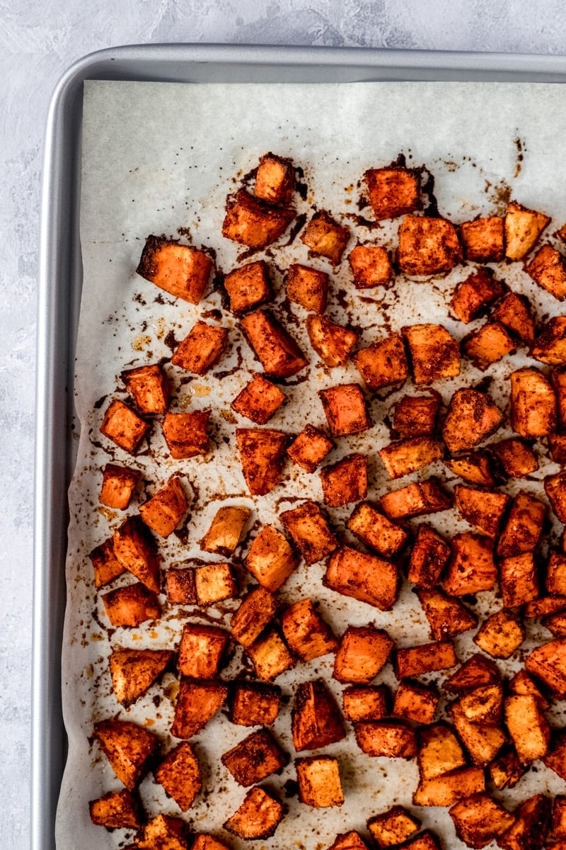 roasted sweet potatoes on a sheet pan