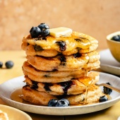 buttermilk blueberry pancakes in a stack on a plate