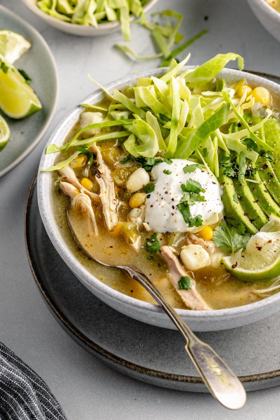 chicken pozole in a bowl with a spoon