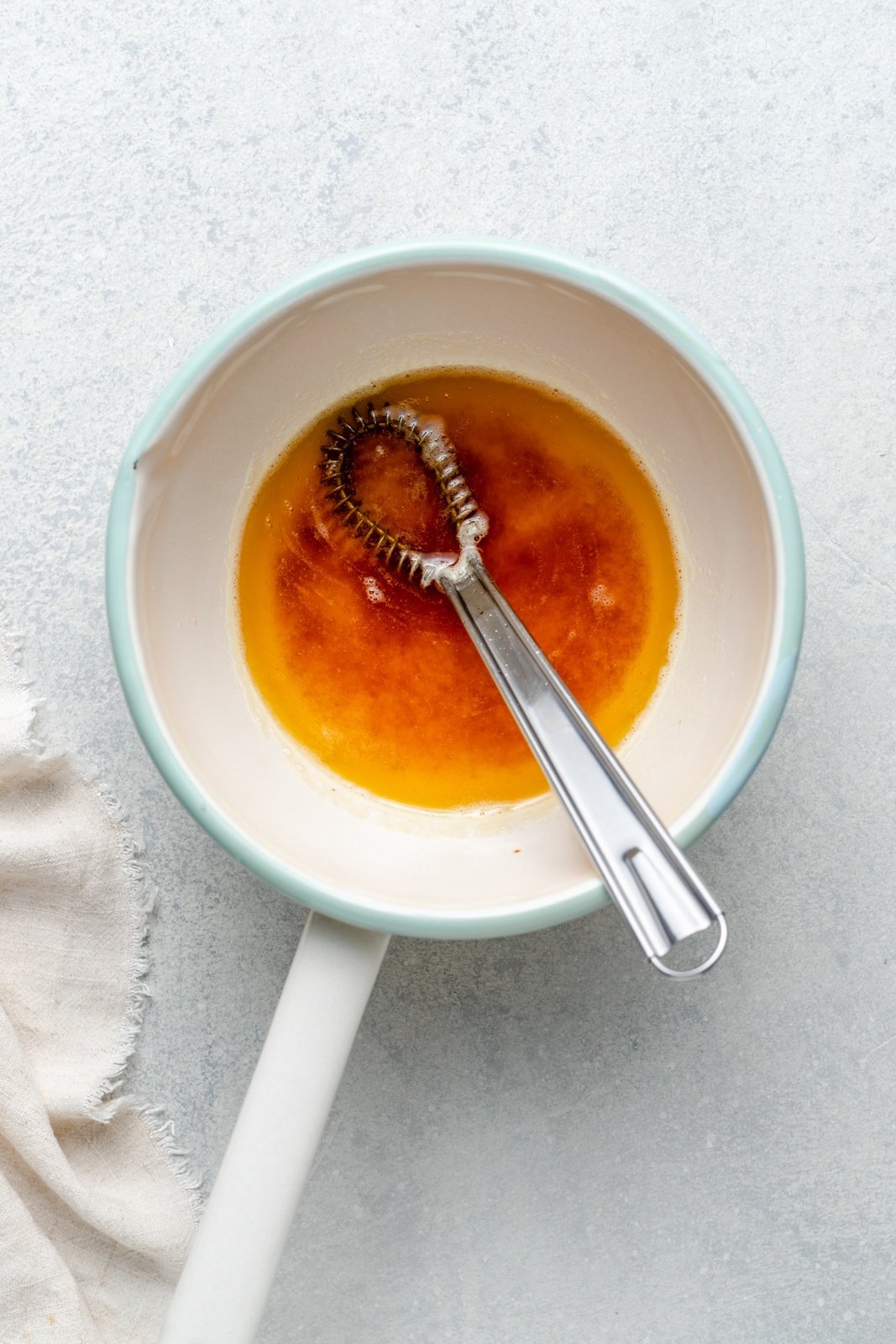 making brown butter in a saucepan for brown butter pear baked oatmeal