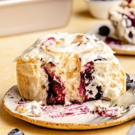 lemon blueberry sweet roll on a plate