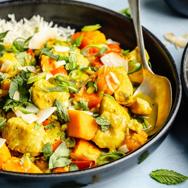 one pot chicken green curry in a bowl with rice