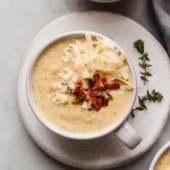 cheddar cauliflower broccoli soup in a bowl