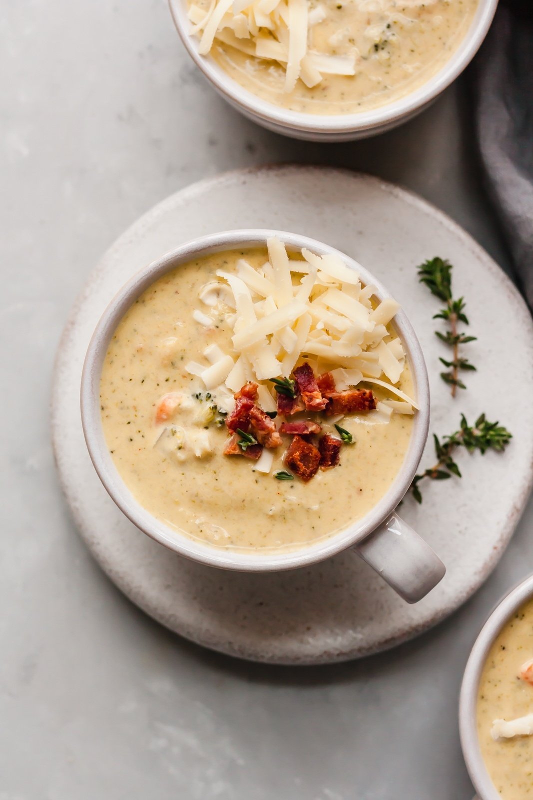 cheddar cauliflower broccoli soup in a mug bowl