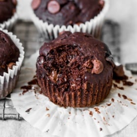 healthy chocolate banana muffin with a bite taken out