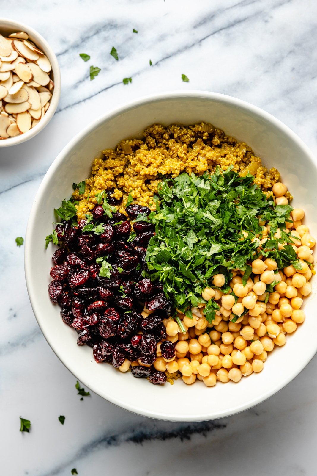 ingredients in a bowl for a moroccan chickpea quinoa salad