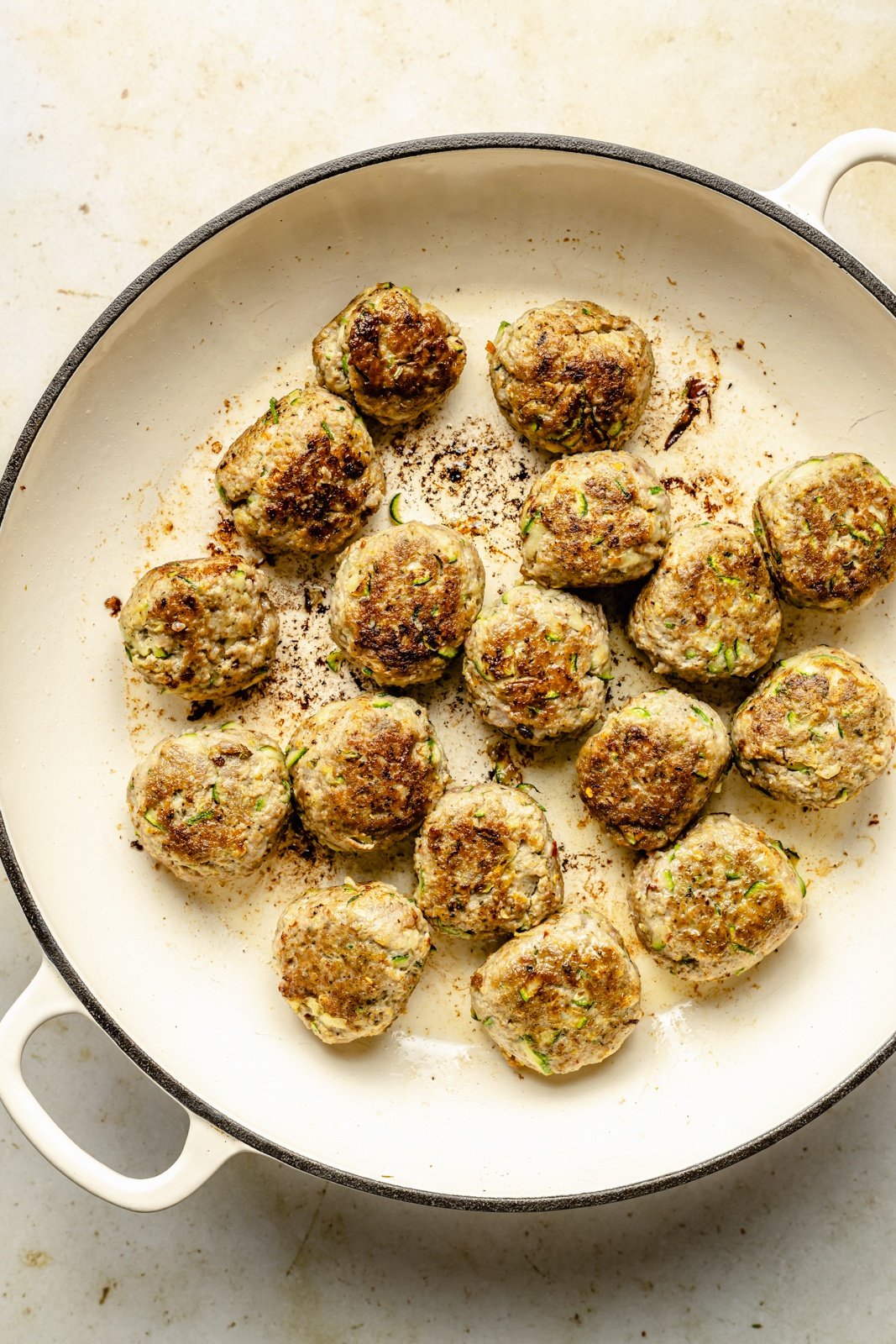 cooking meatballs for pesto chicken orzo