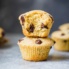 healthy orange chocolate chip muffins in a stack