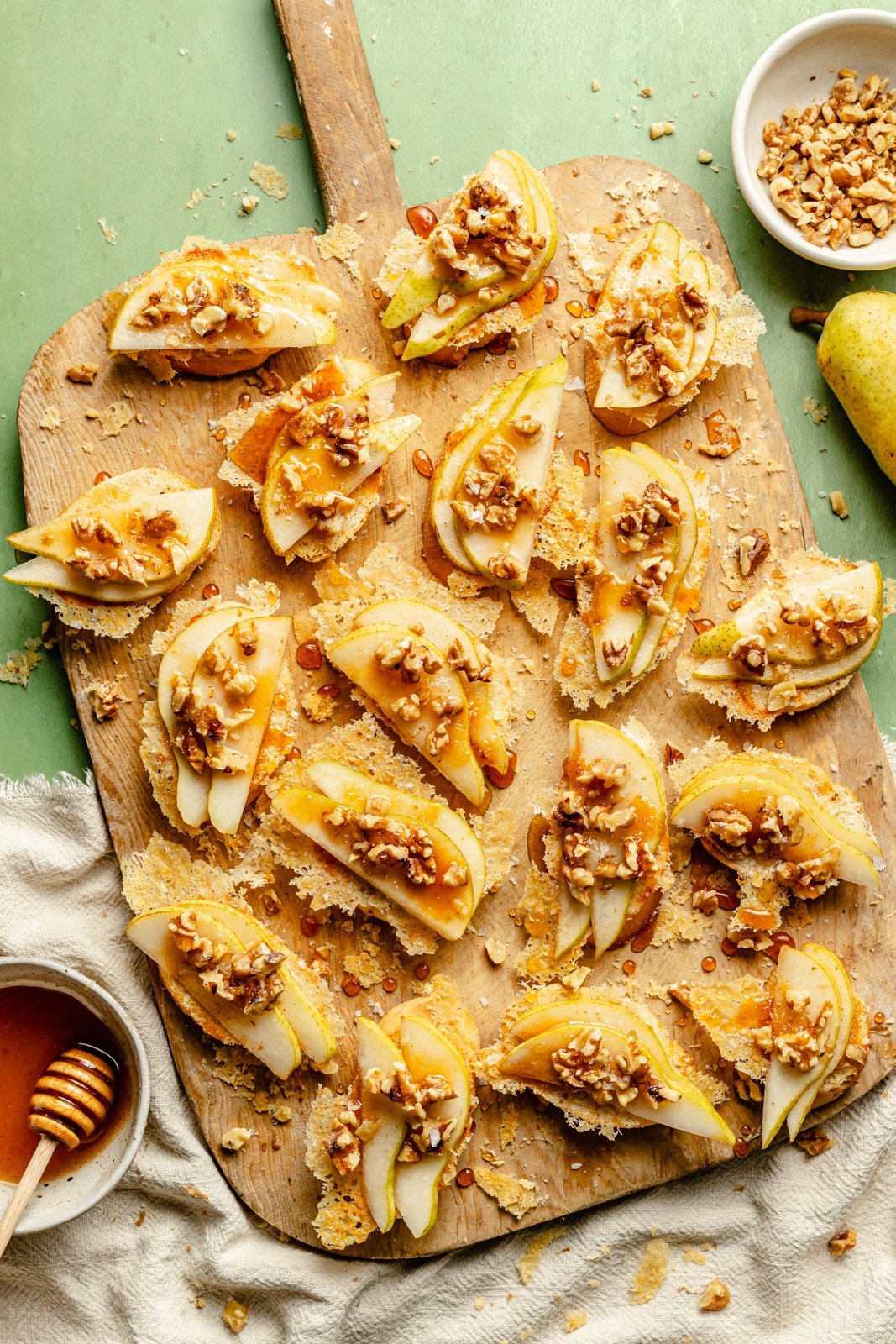 parmesan pear crostini on a cutting board