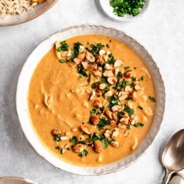 pumpkin peanut butter chicken soup in a bowl