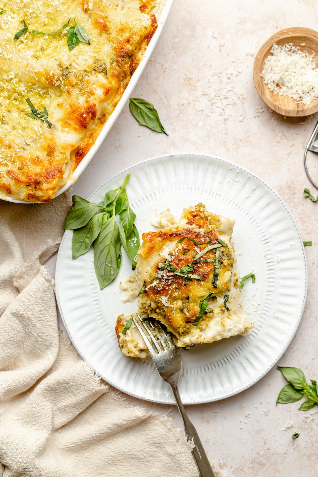 chicken lasagna on a plate with a fork