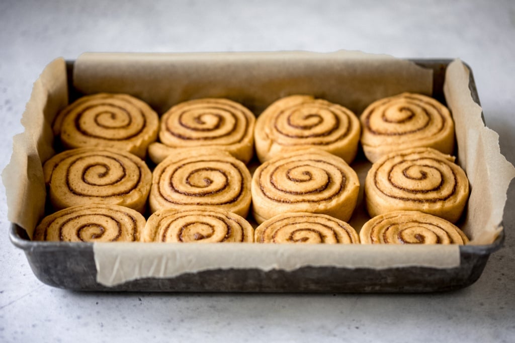 pumpkin cinnamon rolls in a pan before baking