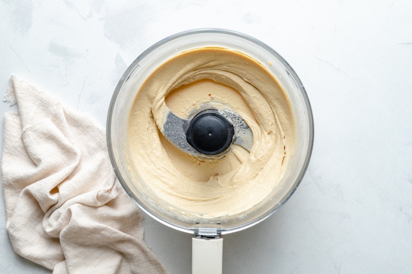 homemade roasted garlic hummus in a food processor