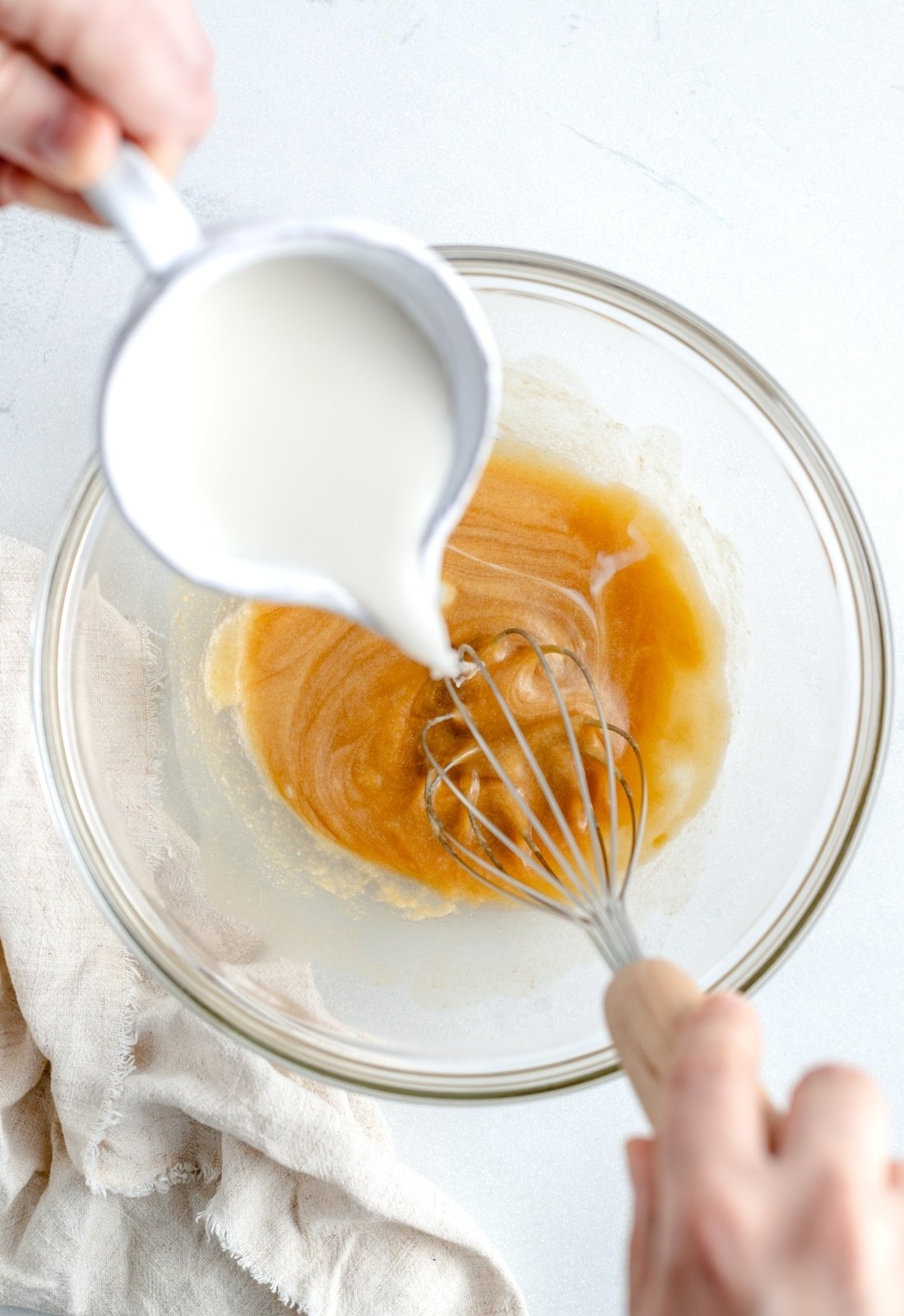 adding milk to wet ingredients for brown butter pancakes