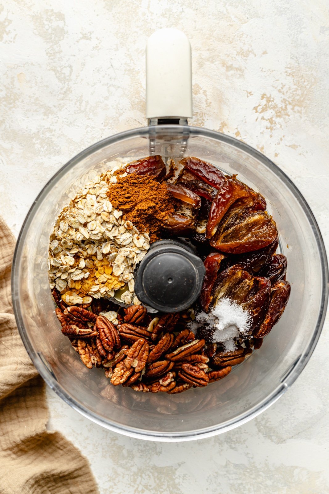 ingredients for pecan pie energy bites in a food processor