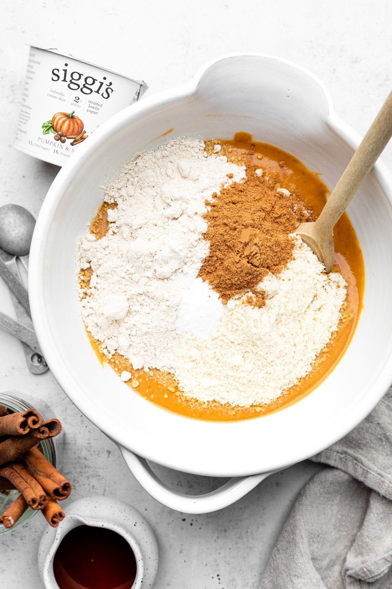 ingredients for gluten free pumpkin cake in a mixing bowl