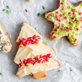 soft cut out sugar cookies decorated on a baking sheet