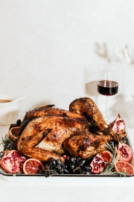 maple roasted turkey on a platter with fruit