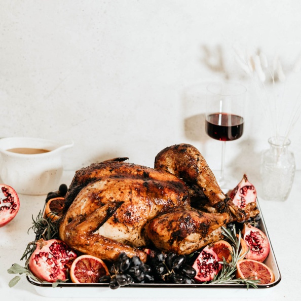 maple roasted turkey on a platter with fruit