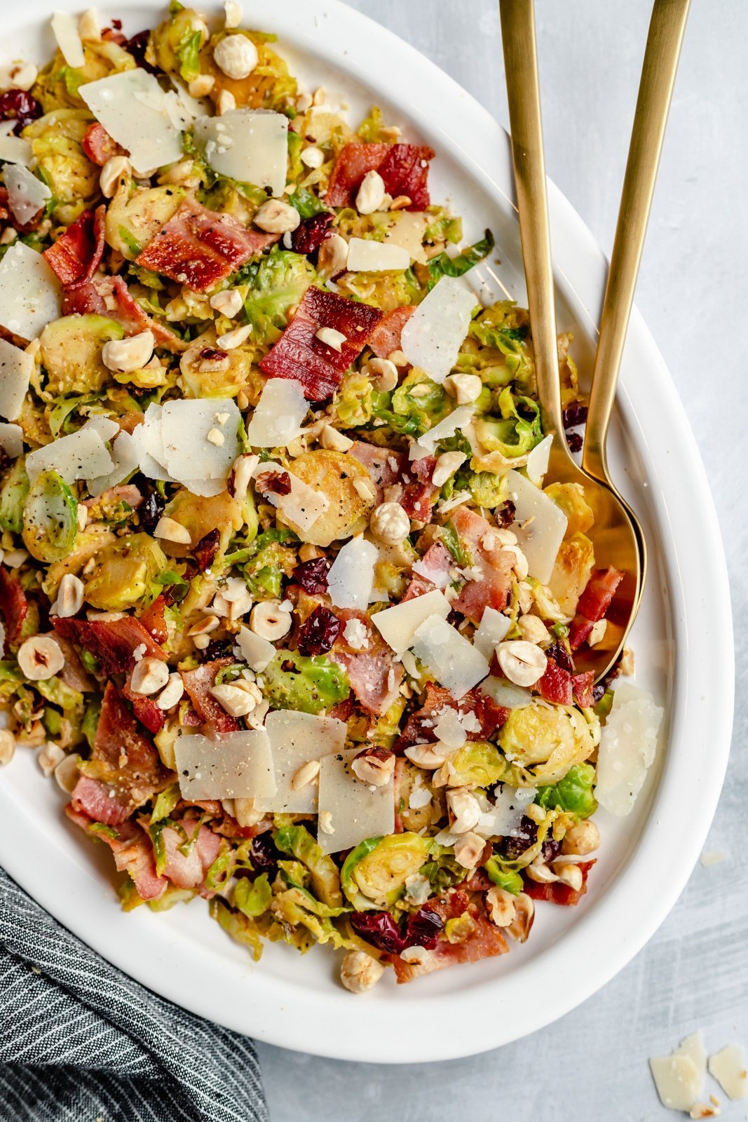 warm brussels sprouts salad on a platter with serving utensils