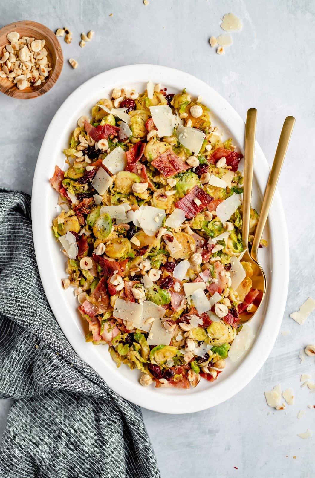 low carb warm brussels sprouts salad on a platter with serving utensils