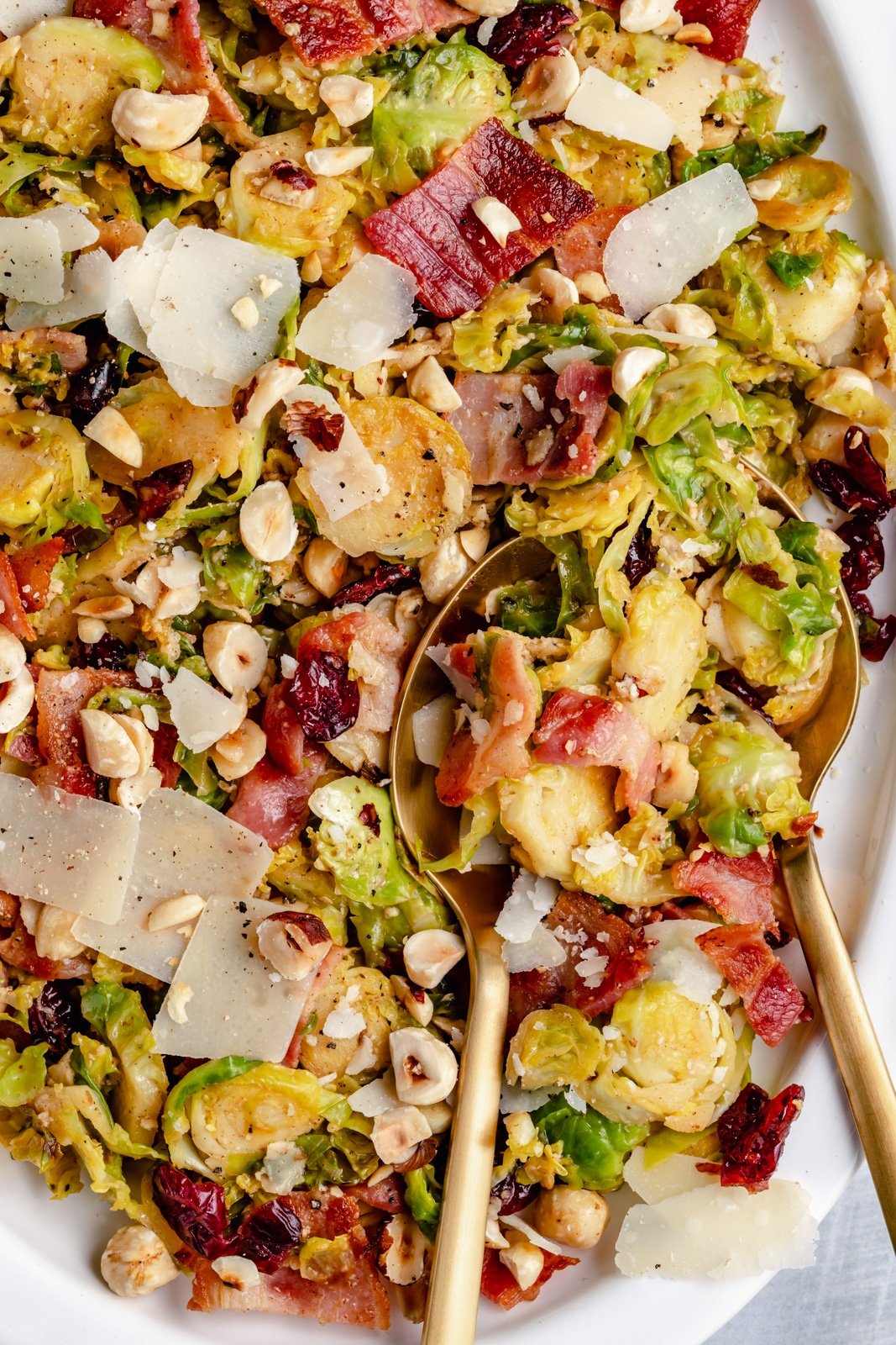 easy warm brussels sprouts salad with bacon on a serving tray