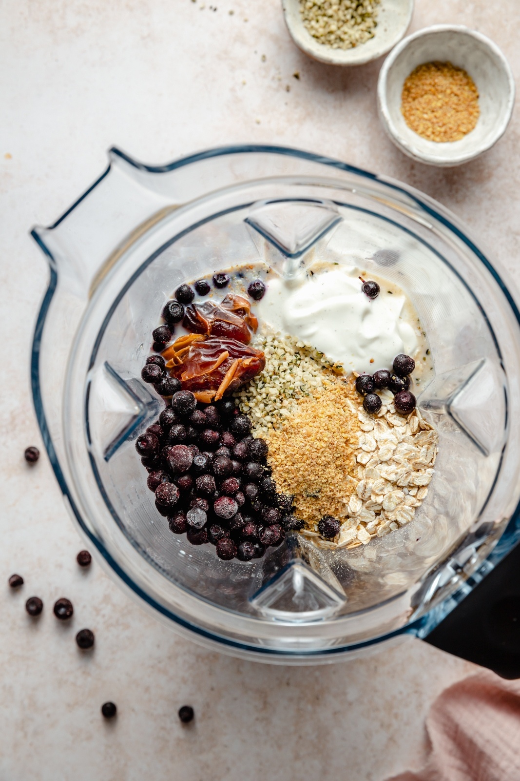 ingredients for a blueberry muffin smoothie in a blender